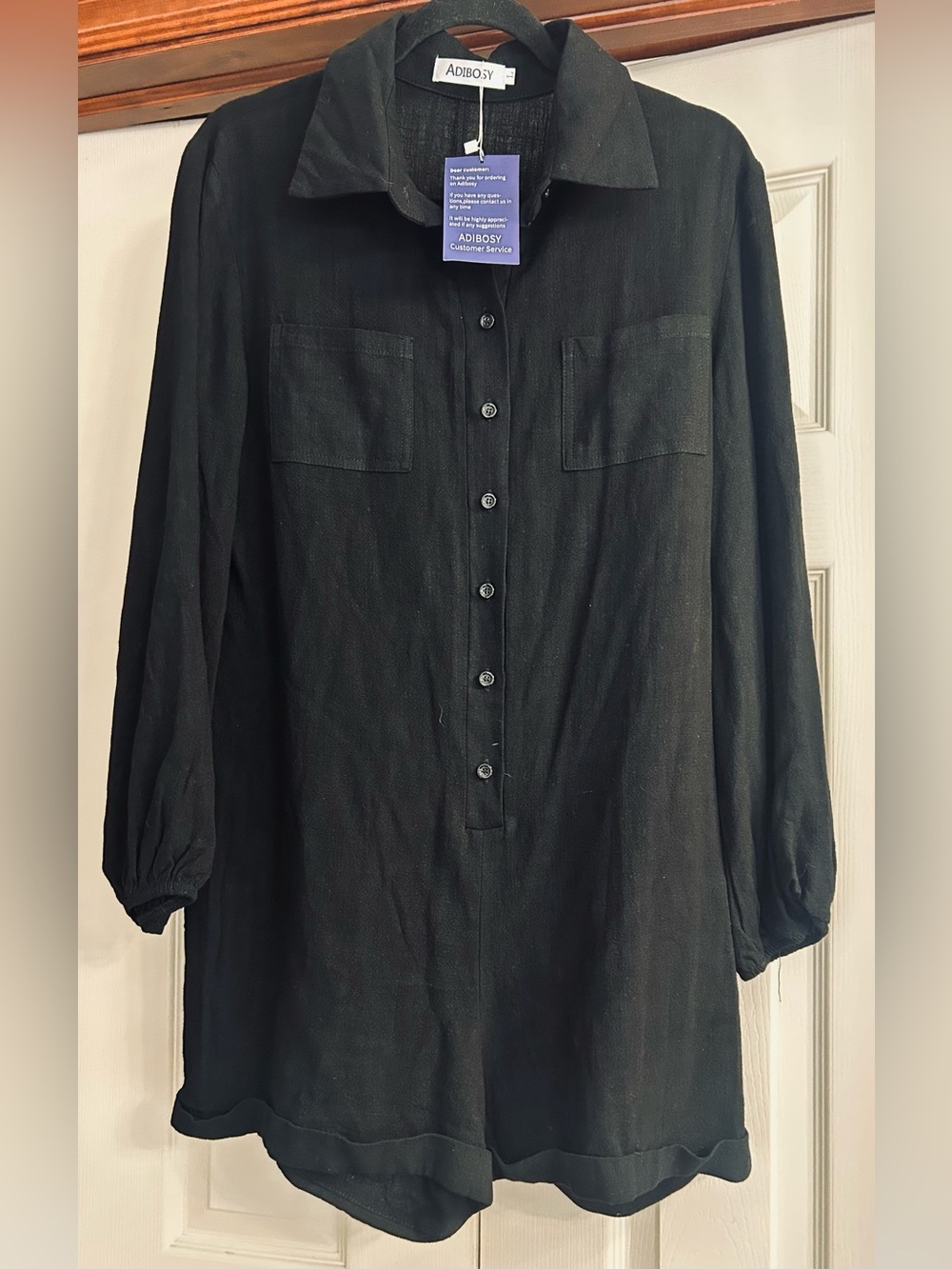Black Long-Sleeve Button Front Romper  by Adibosy.   New With Tags
